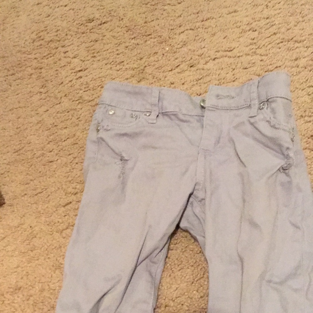 Some gray jeans and a purple skirt causal